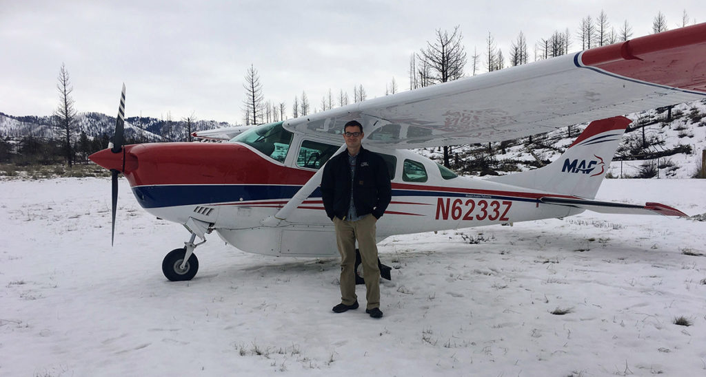 Andrew Standing By Plane