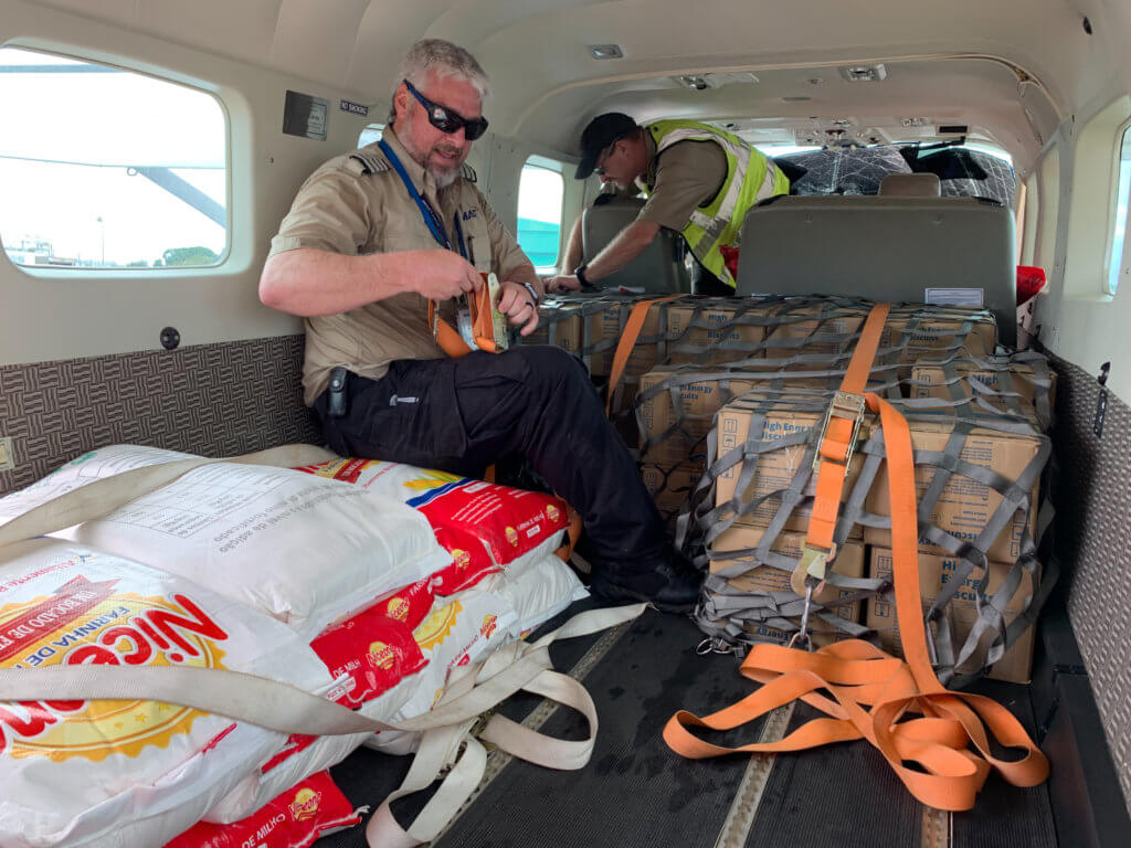 Mission Aviation Fellowship loads disaster relief supplies on Cessna Caravan in Mozambique