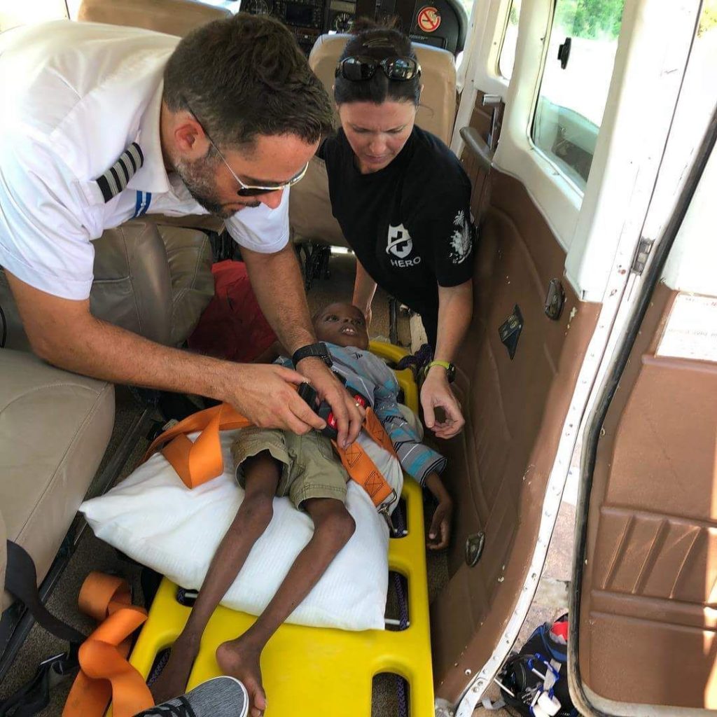 Orphaned boy being treated onboard the airplane