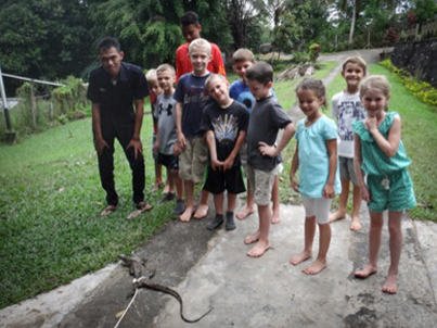 Experience wildlife outside and inside the classroom. This monitor lizard showed up in the school room one morning. (Incidentally, the kids had prayed for one. The teachers? Not so much.)