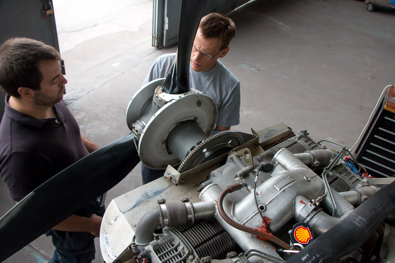 Pilot Kevin Spann and mechanic David Burton working on one of the airplanes in Kinshasa, DRC.